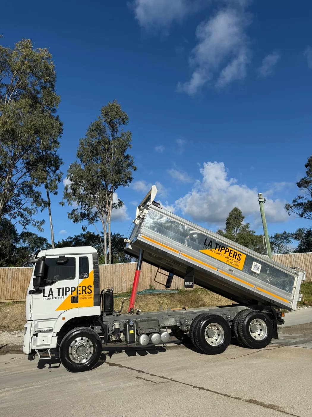 LA Tippers tipper truck tipping a load on a Gold Coast site