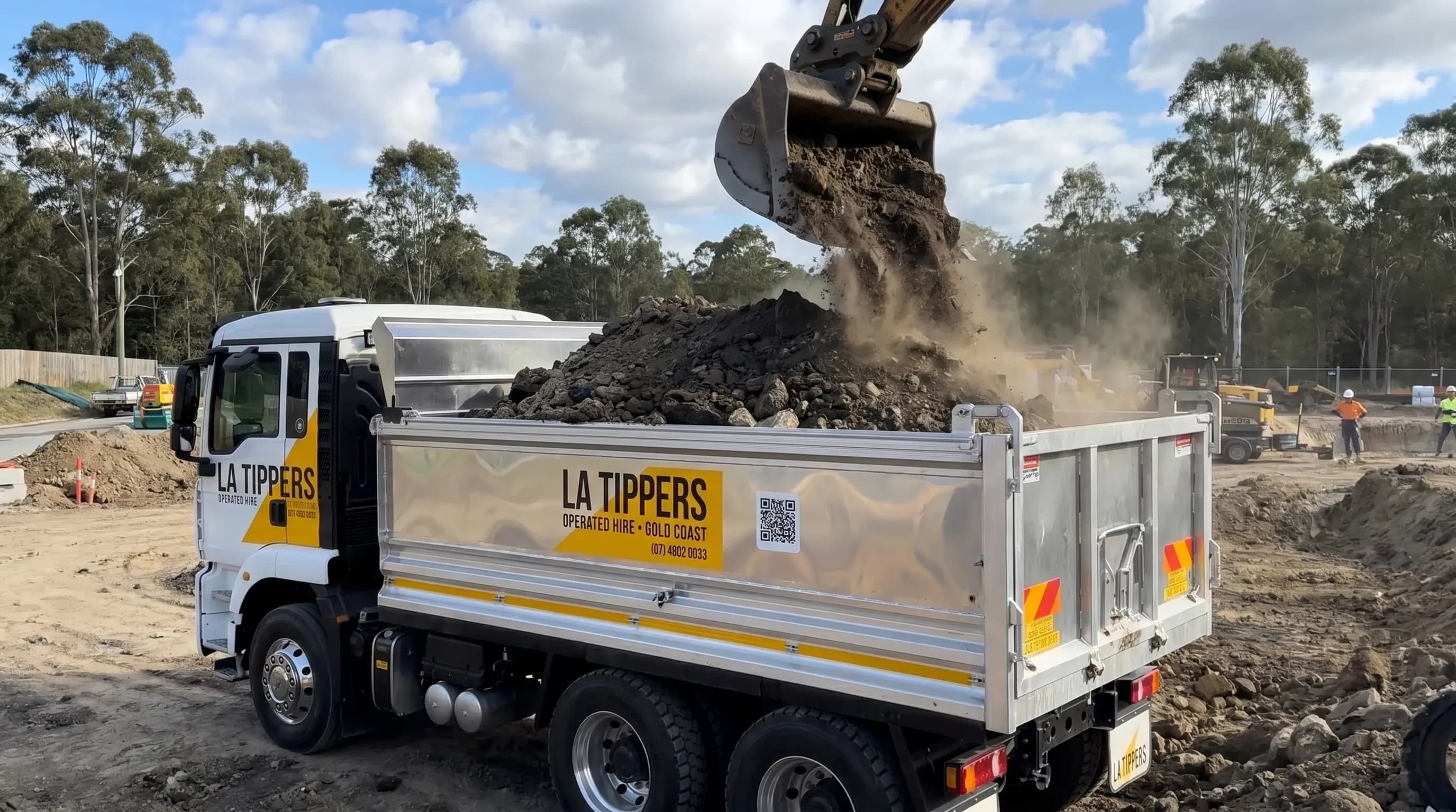 Tipper truck loaded with excavation spoil being removed from a Gold Coast civil site